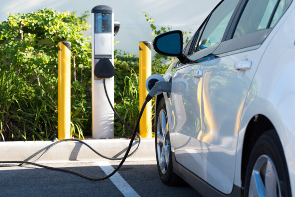 An electric car charging in California